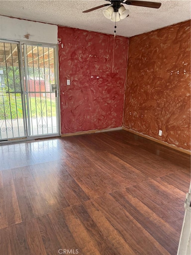 1317 S Baker St, Santa Ana, CA 92707 - spare room featuring ceiling fan, a textured ceiling, and hardwood / wood-style flooring