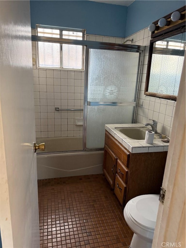 1317 S Baker St, Santa Ana, CA 92707 - full bathroom with vanity, combined bath / shower with glass door, and tile patterned floors