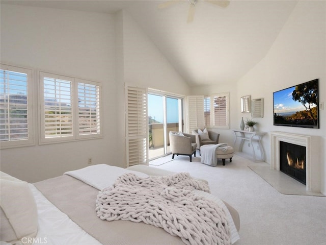 34 Via Capri, Rancho Palos Verdes, CA 90275 - carpeted bedroom with access to outside, high vaulted ceiling, a warm lit fireplace, and ceiling fan