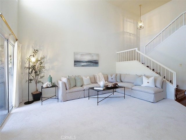 34 Via Capri, Rancho Palos Verdes, CA 90275 - living room featuring carpet floors, stairs, and a towering ceiling