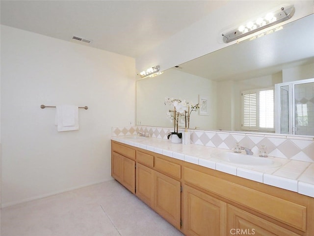 34 Via Capri, Rancho Palos Verdes, CA 90275 - full bathroom with double vanity, tasteful backsplash, and a shower with door