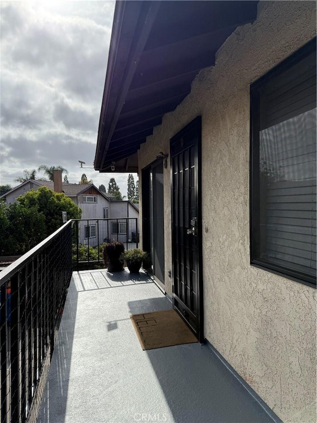 3935 W Mcfadden Ave Unit D, Santa Ana, CA 92704 - property entrance with stucco siding and a balcony
