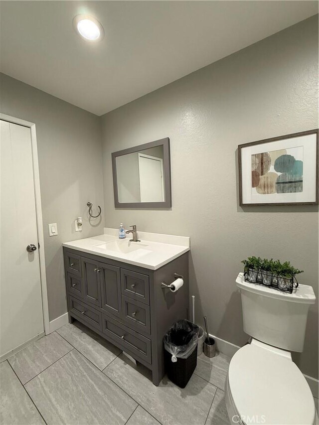 3935 W Mcfadden Ave Unit D, Santa Ana, CA 92704 - half bath featuring vanity and tile patterned floors