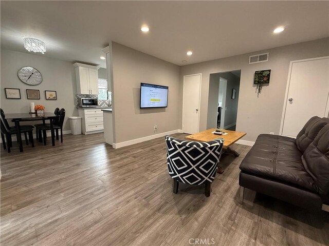 3935 W Mcfadden Ave Unit D, Santa Ana, CA 92704 - living room featuring wood finished floors and recessed lighting