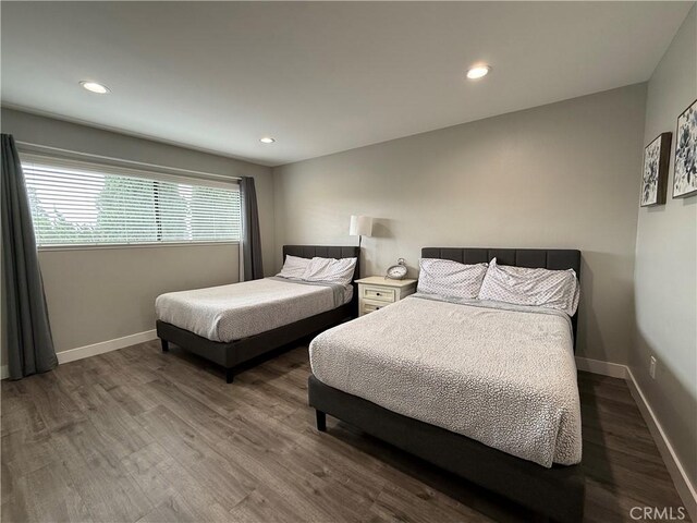 3935 W Mcfadden Ave Unit D, Santa Ana, CA 92704 - bedroom with wood finished floors and recessed lighting