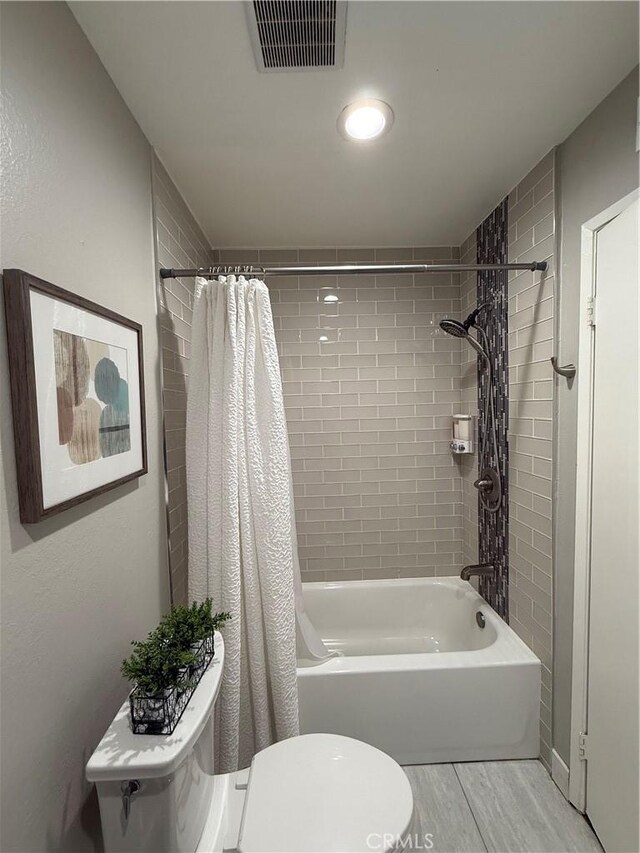 3935 W Mcfadden Ave Unit D, Santa Ana, CA 92704 - full bath featuring shower / bathtub combination with curtain and wood finished floors