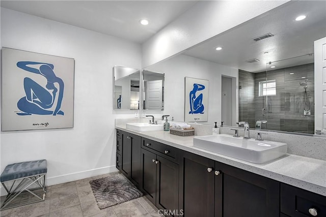 20211 W Liverpool Way, Porter Ranch, CA 91326 - full bath with double vanity, a shower stall, recessed lighting, and tile patterned floors