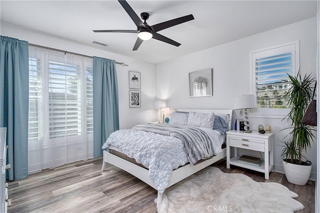 20211 W Liverpool Way, Porter Ranch, CA 91326 - bedroom with multiple windows, wood finished floors, and a ceiling fan