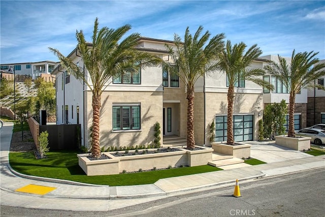 20211 W Liverpool Way, Porter Ranch, CA 91326 - view of front of house with an attached garage, driveway, and stucco siding