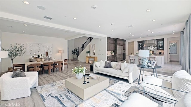 80 Interstellar, Irvine, CA 92618 - living area featuring stairway, recessed lighting, and light wood-style flooring