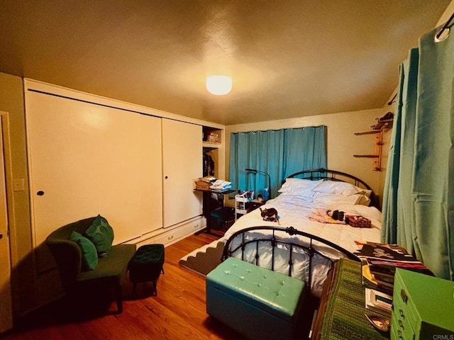 129 Brass Ln, Vista, CA 92083 - bedroom with wood finished floors and a baseboard radiator