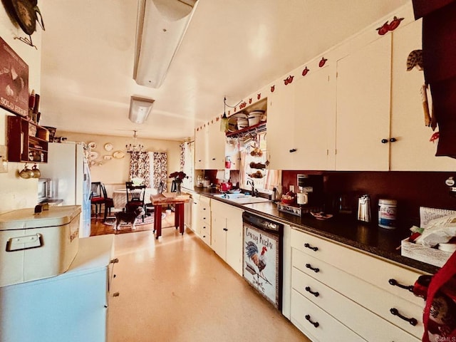 129 Brass Ln, Vista, CA 92083 - kitchen with dishwasher, white cabinetry, dark countertops, and freestanding refrigerator