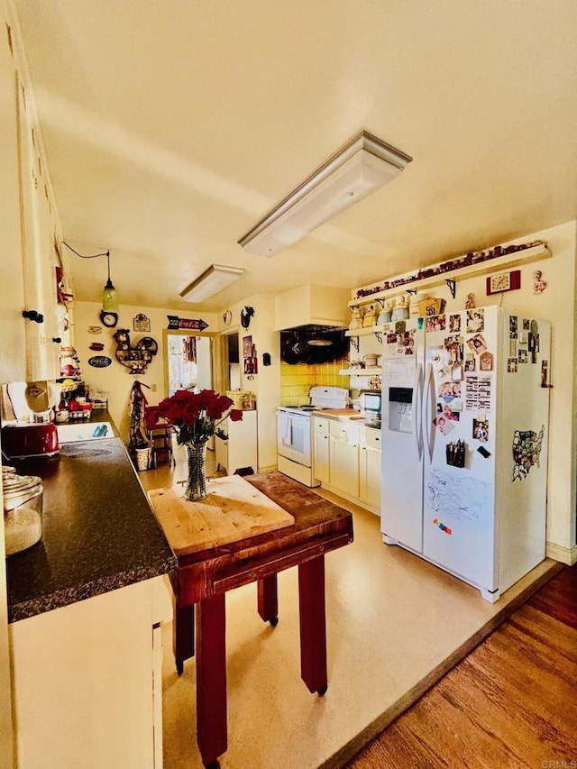 129 Brass Ln, Vista, CA 92083 - kitchen featuring white appliances, white cabinetry, and dark countertops