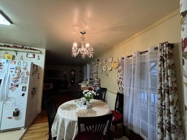 129 Brass Ln, Vista, CA 92083 - dining space with a chandelier, wood finished floors, and crown molding