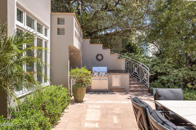 1040 Hillcroft Rd, Glendale, CA 91207 - view of patio with exterior kitchen, outdoor dining space, and stairs