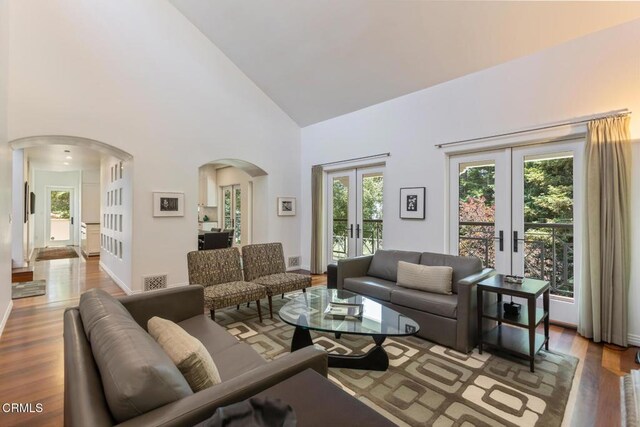 1040 Hillcroft Rd, Glendale, CA 91207 - living area with french doors, arched walkways, wood finished floors, and high vaulted ceiling
