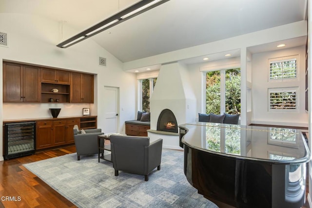 1040 Hillcroft Rd, Glendale, CA 91207 - living room with wine cooler, dark wood-style floors, healthy amount of natural light, high vaulted ceiling, and recessed lighting