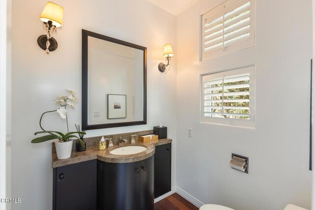 1040 Hillcroft Rd, Glendale, CA 91207 - half bathroom featuring vanity and wood finished floors