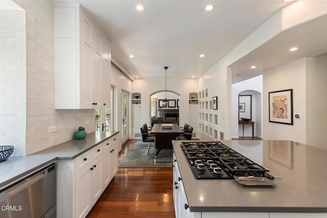1040 Hillcroft Rd, Glendale, CA 91207 - kitchen featuring arched walkways, stainless steel dishwasher, white cabinets, black gas cooktop, and recessed lighting