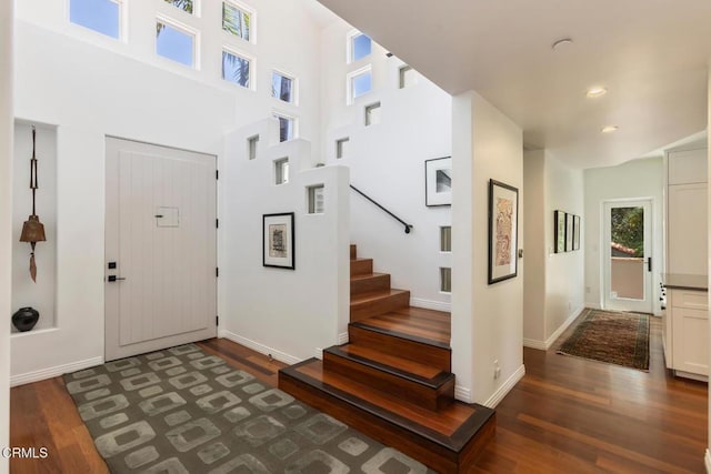 1040 Hillcroft Rd, Glendale, CA 91207 - entryway with dark wood-type flooring, stairs, a towering ceiling, and recessed lighting