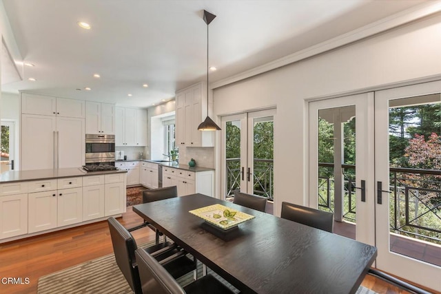 1040 Hillcroft Rd, Glendale, CA 91207 - dining area with french doors, dark wood finished floors, and recessed lighting