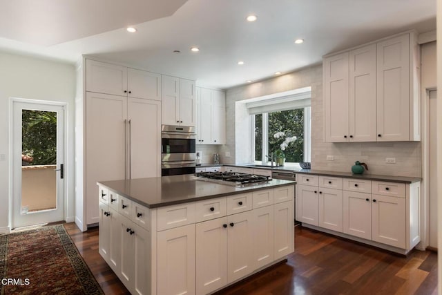1040 Hillcroft Rd, Glendale, CA 91207 - kitchen with stainless steel appliances, dark countertops, dark wood-style floors, backsplash, and recessed lighting
