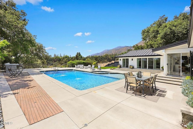 1305 Riviera Dr, Pasadena, CA 91107 - view of pool with a mountain view, a patio area, outdoor dining area, and a pool with connected hot tub