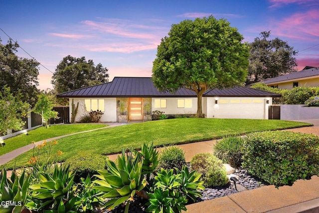 1305 Riviera Dr, Pasadena, CA 91107 - view of front of property featuring a standing seam roof, an attached garage, a metal roof, and stucco siding