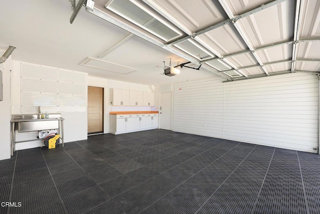 1305 Riviera Dr, Pasadena, CA 91107 - garage with a garage door opener and a sink