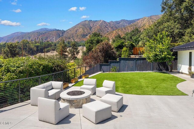 1305 Riviera Dr, Pasadena, CA 91107 - fenced backyard with a mountain view, a patio area, and an outdoor living space with a fire pit
