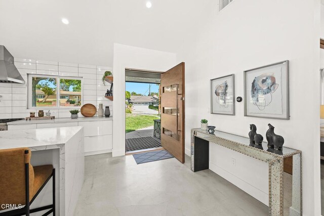 1305 Riviera Dr, Pasadena, CA 91107 - foyer featuring plenty of natural light, finished concrete floors, recessed lighting, and a towering ceiling