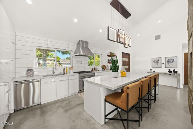 1305 Riviera Dr, Pasadena, CA 91107 - kitchen with appliances with stainless steel finishes, range hood, concrete flooring, white cabinets, and a kitchen island