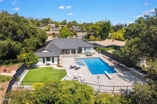 1305 Riviera Dr, Pasadena, CA 91107 - view of swimming pool with a fenced backyard, a patio, a pool with connected hot tub, and a diving board