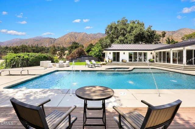 1305 Riviera Dr, Pasadena, CA 91107 - view of pool with a mountain view, a patio area, and a pool with connected hot tub