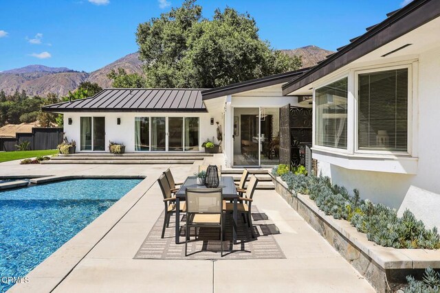 1305 Riviera Dr, Pasadena, CA 91107 - view of swimming pool featuring a mountain view, a patio area, and outdoor dining area