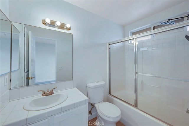 1211 E Carson St Unit 27, Carson, CA 90745 - bathroom featuring vanity and shower / bath combination with glass door