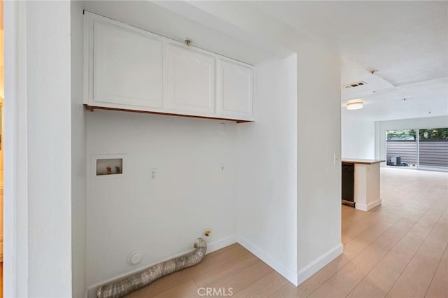 1211 E Carson St Unit 27, Carson, CA 90745 - laundry room with gas dryer hookup, cabinet space, light wood finished floors, and hookup for a washing machine