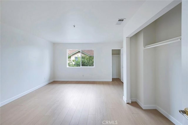 1211 E Carson St Unit 27, Carson, CA 90745 - unfurnished bedroom with light wood-style flooring and a closet