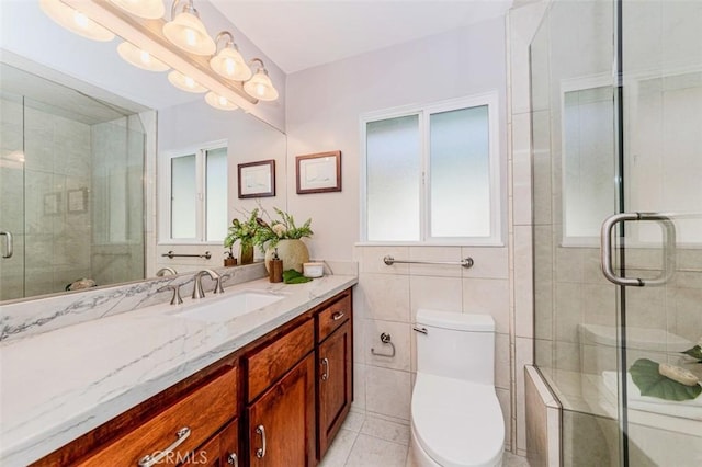 2771 Wyckersham Pl, Fullerton, CA 92833 - full bath featuring vanity, a stall shower, tile patterned floors, and tile walls