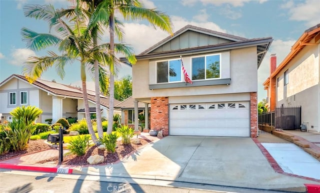 2771 Wyckersham Pl, Fullerton, CA 92833 - traditional-style home featuring brick siding, a garage, concrete driveway, stucco siding, and board and batten siding