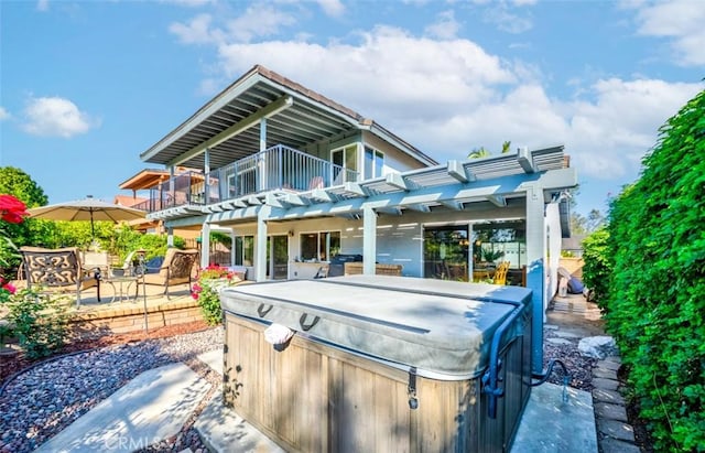 2771 Wyckersham Pl, Fullerton, CA 92833 - back of house with a hot tub, a balcony, a patio, and a pergola