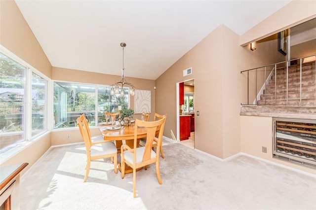 2771 Wyckersham Pl, Fullerton, CA 92833 - dining room with vaulted ceiling, carpet floors, stairs, beverage cooler, and a chandelier
