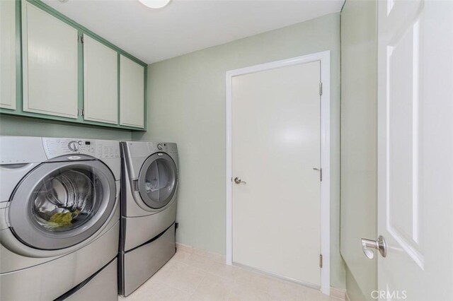 2771 Wyckersham Pl, Fullerton, CA 92833 - laundry room featuring washing machine and dryer, cabinet space, and light tile patterned floors