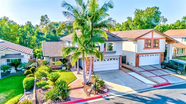 2771 Wyckersham Pl, Fullerton, CA 92833 - view of front of property featuring a garage, stucco siding, driveway, and a tiled roof