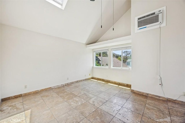 1263 Pismo St, San Luis Obispo, CA 93401 - empty room with a wall unit AC, high vaulted ceiling, and a skylight