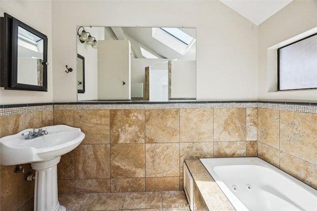 1263 Pismo St, San Luis Obispo, CA 93401 - bathroom with a skylight, plenty of natural light, a jetted tub, tile walls, and vaulted ceiling