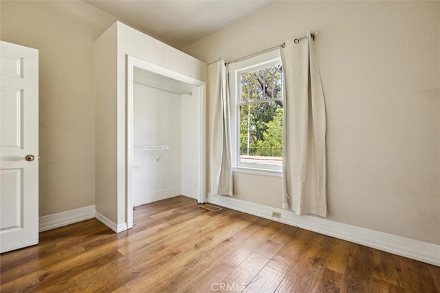 1263 Pismo St, San Luis Obispo, CA 93401 - unfurnished bedroom with wood finished floors and a closet
