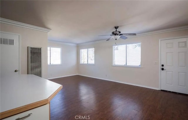 1263 Pismo St, San Luis Obispo, CA 93401 - unfurnished living room with a heating unit, dark wood-type flooring, a ceiling fan, and crown molding