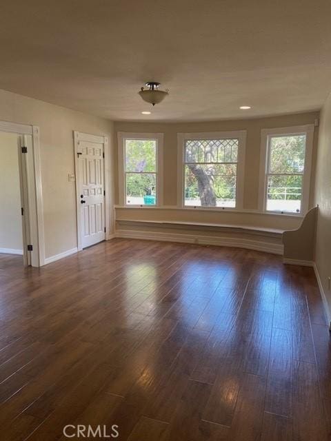 1263 Pismo St, San Luis Obispo, CA 93401 - unfurnished living room with dark wood-style floors and recessed lighting