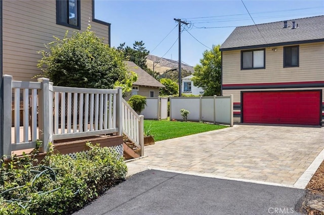1263 Pismo St, San Luis Obispo, CA 93401 - view of yard with decorative driveway and a garage